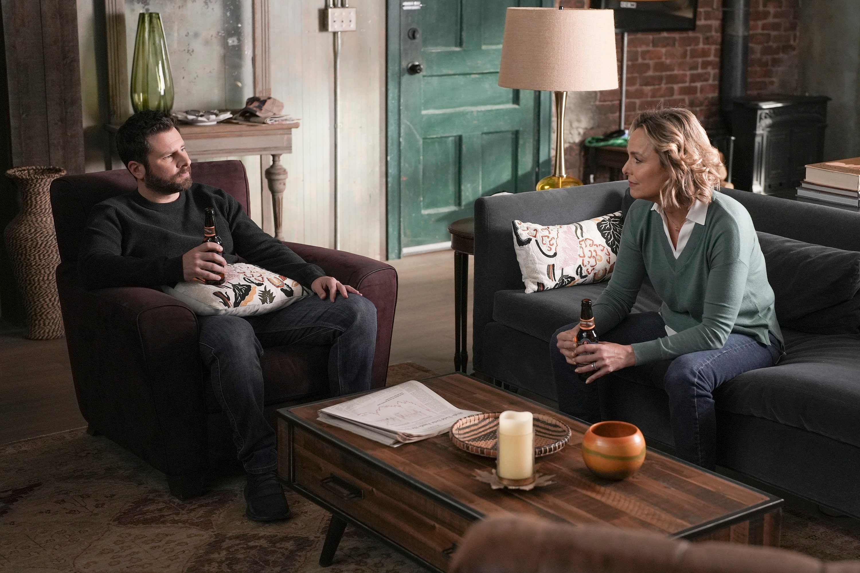'A Million Little Things' James Roday Rodriguez as Gary and Melora Hardin as Patricia Bloom talking together while having a drink