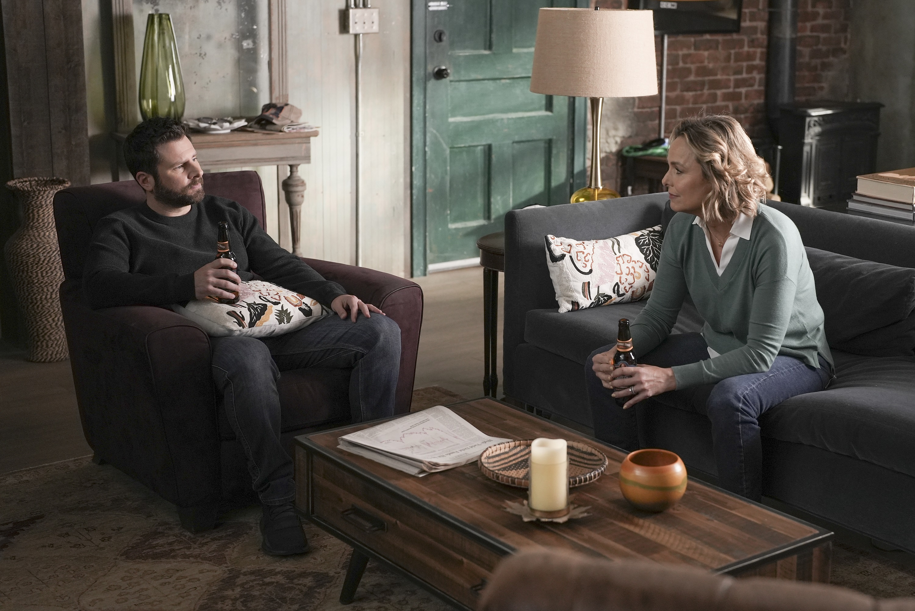 'A Million Little Things' James Roday Rodriguez as Gary and Melora Hardin as Patricia Bloom talking together while having a drink