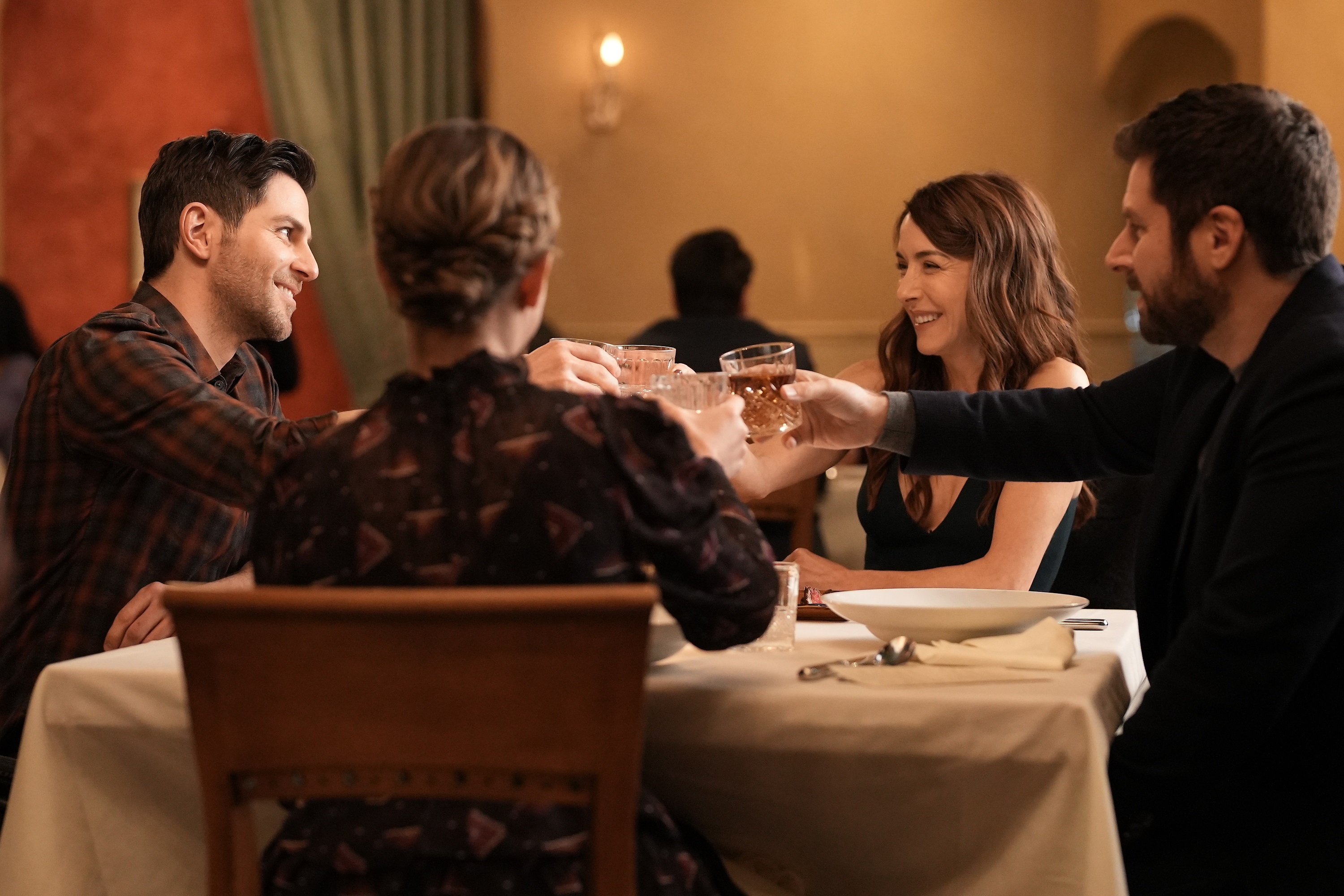 'A Million Little Things' David Giuntoli, Erin Karpluk and James Roday Rodriguez raise their glasses together as Eddie, Anna, and Gary