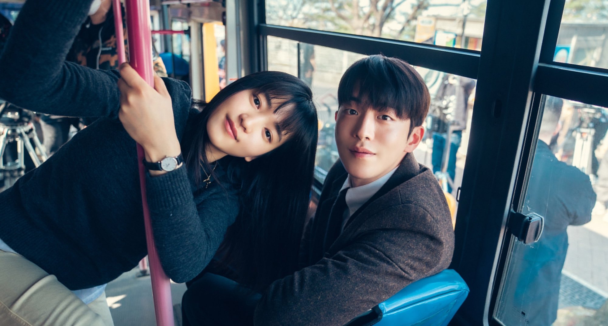 Actors Kim Tae-ri and Nam Joo-hyuk in 'Twenty-Five Twenty-One' finale sitting in bus.