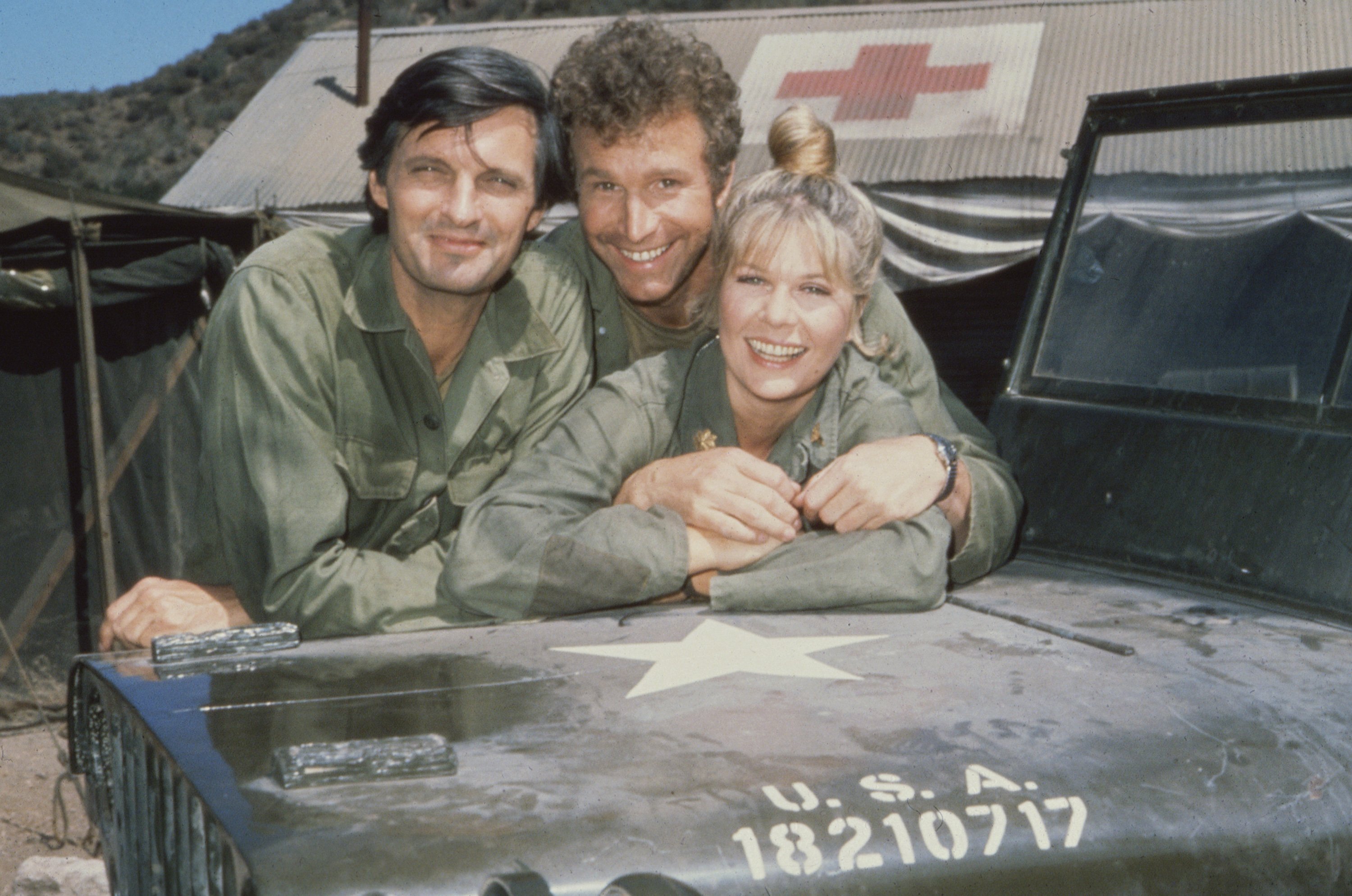Left to right: Actors Alan Alda, Wayne Rogers, and Loretta Swit in 1972 on the set of the long-running CBS comedy-drama 'M*A*S*H'.