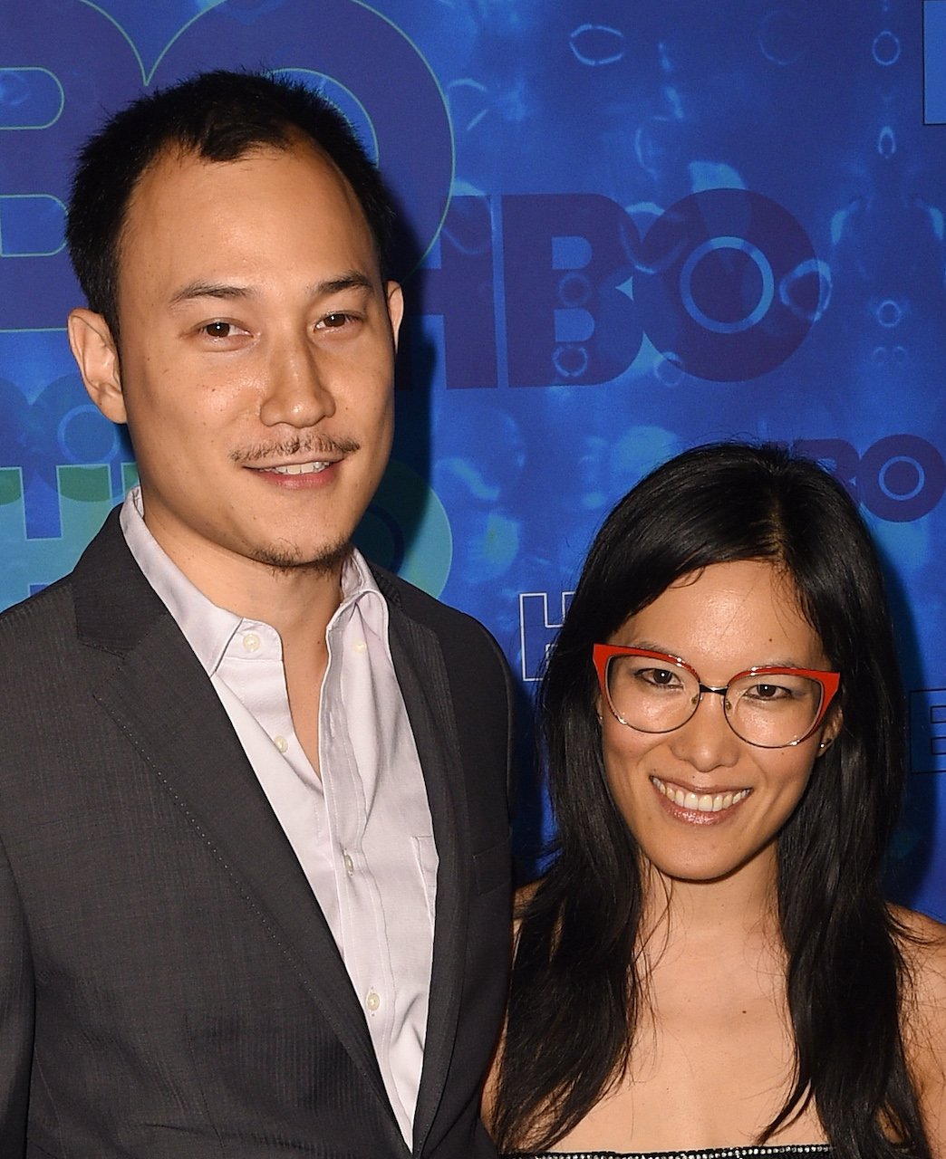 Ali Wong and Justin Hakuta pose on the red carpet - the couple recently announced they are divorcing