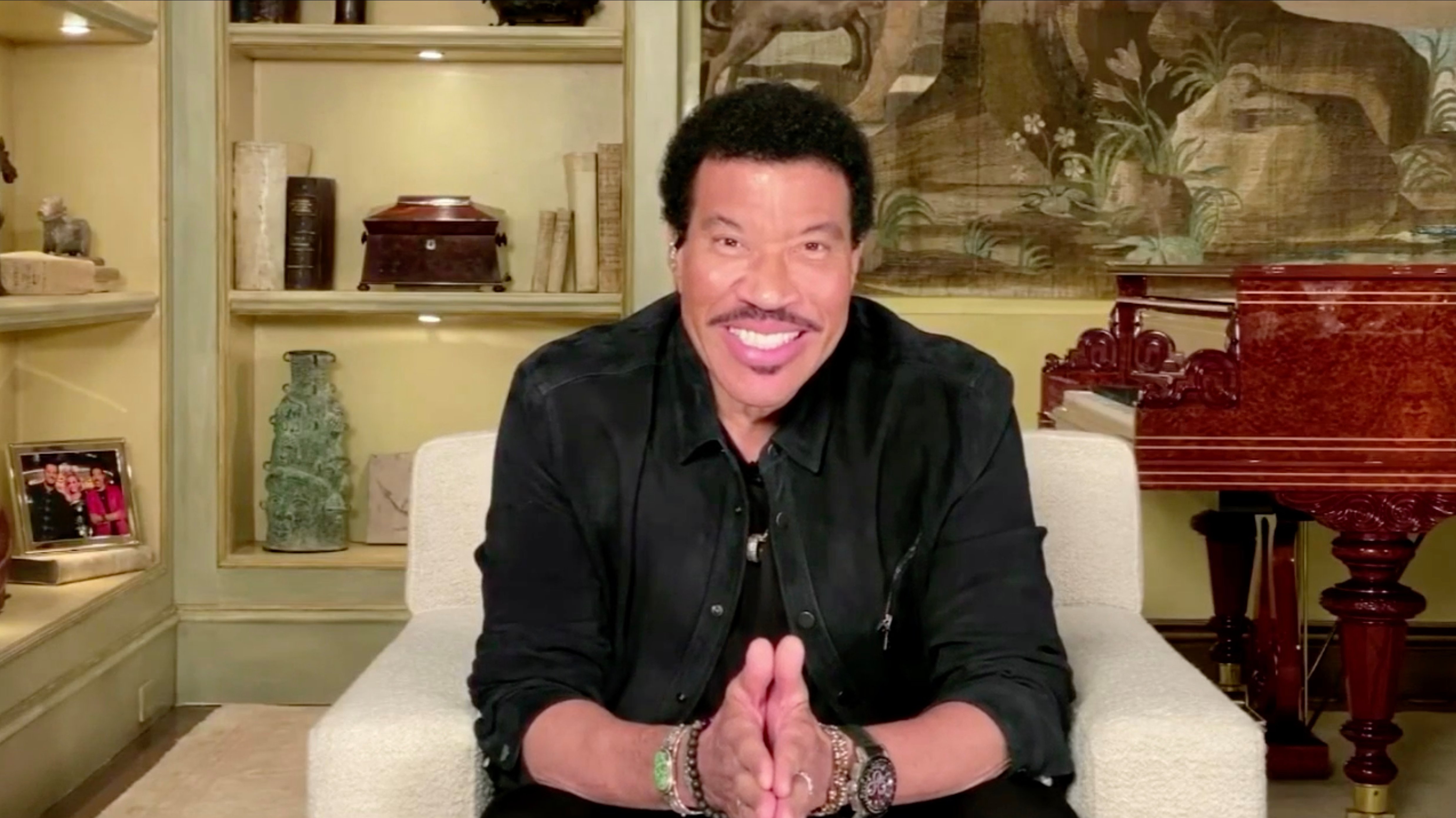'American Idol' judge Lionel Richie sitting in his 28-room mansion