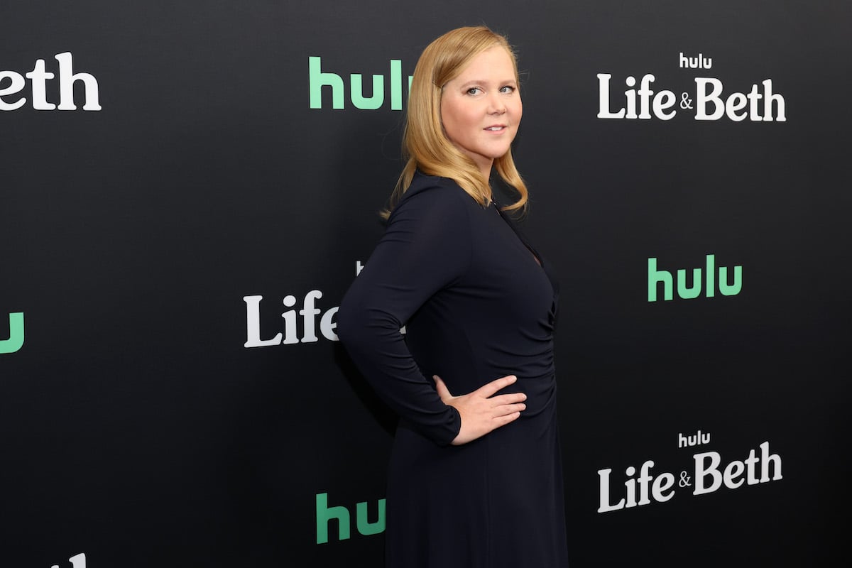 Amy Schumer poses in a black dress at Hulu's 'Life & Beth' premiere