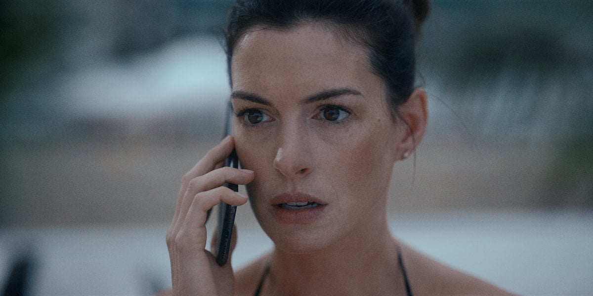 Anne Hathaway holds a phone to her ear in 'WeCrashed' Season 1 Episode 8: 'The One With All the Money'