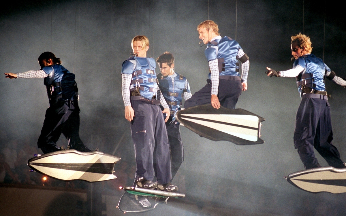 Hanging from harnesses, the Backstreet Boys perform during their 'Into the Millennium' tour in Germany on April 3,1999.