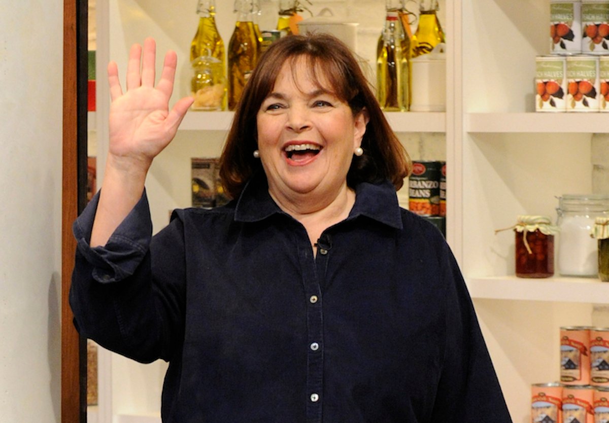 'Barefoot Contessa' host, Ina Garten, waves and smiles wearing a black button-down shirt