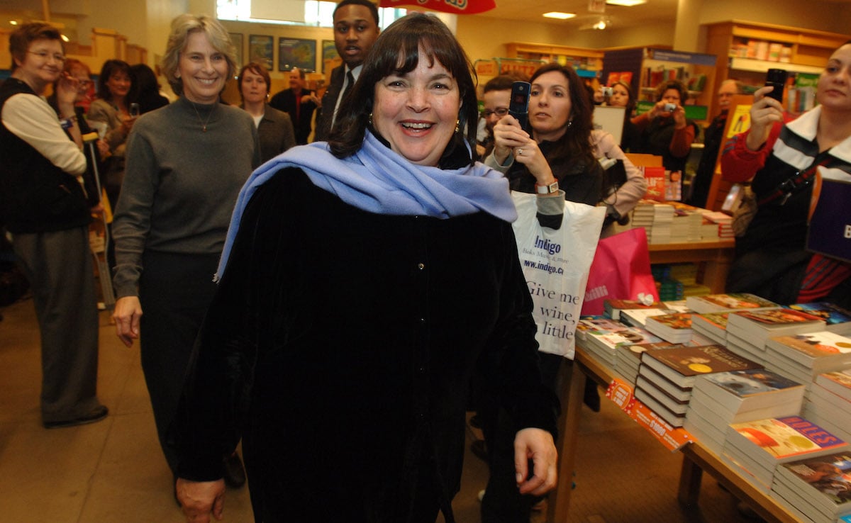 'Barefoot Contessa' host, Ina Garten smiles waring a black shirt and blue scarf