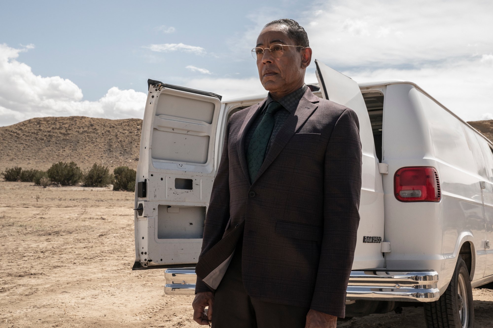 Giancarlo Esposito as Gus Fring in 'Better Call Saul' Season 6 Episode 3. He's standing in the desert in front of a white van.