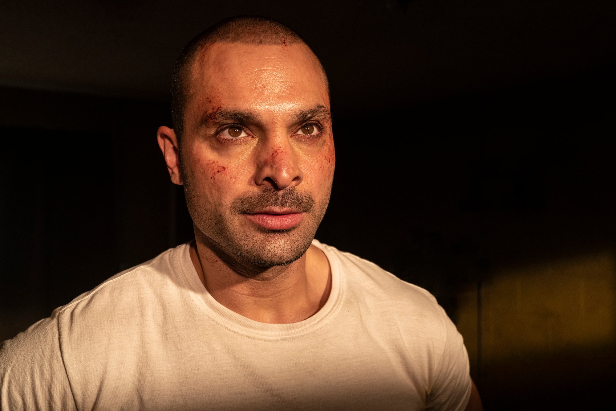 'Better Call Saul' Season 6: Nacho Vargas (Michael Mando) stands with cuts on his face