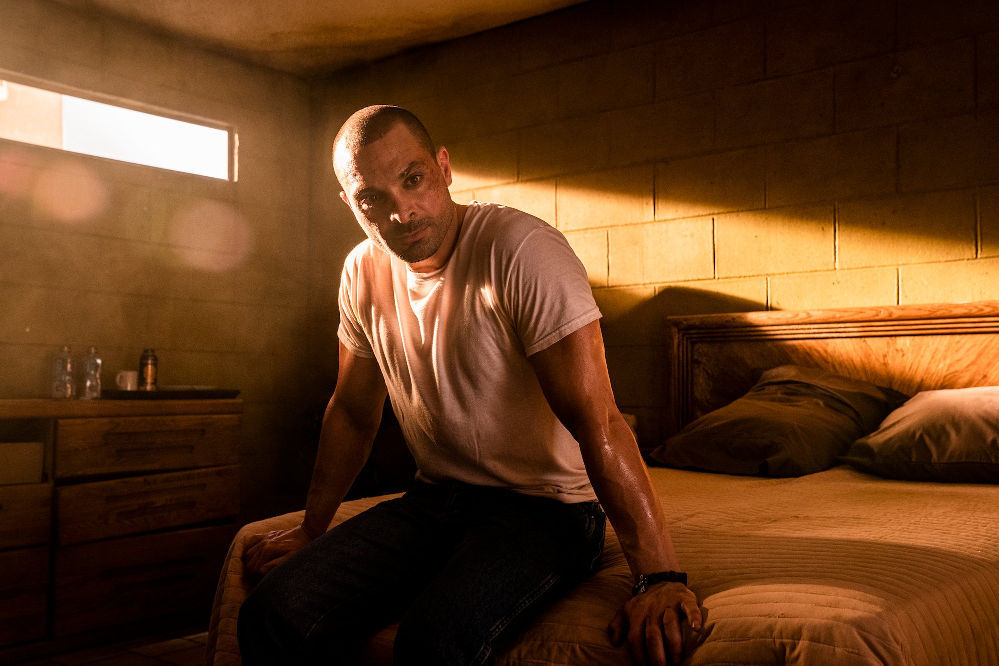 'Better Call Saul': Nacho Varga (Michael Mando) sits on a bed in a hot motel room