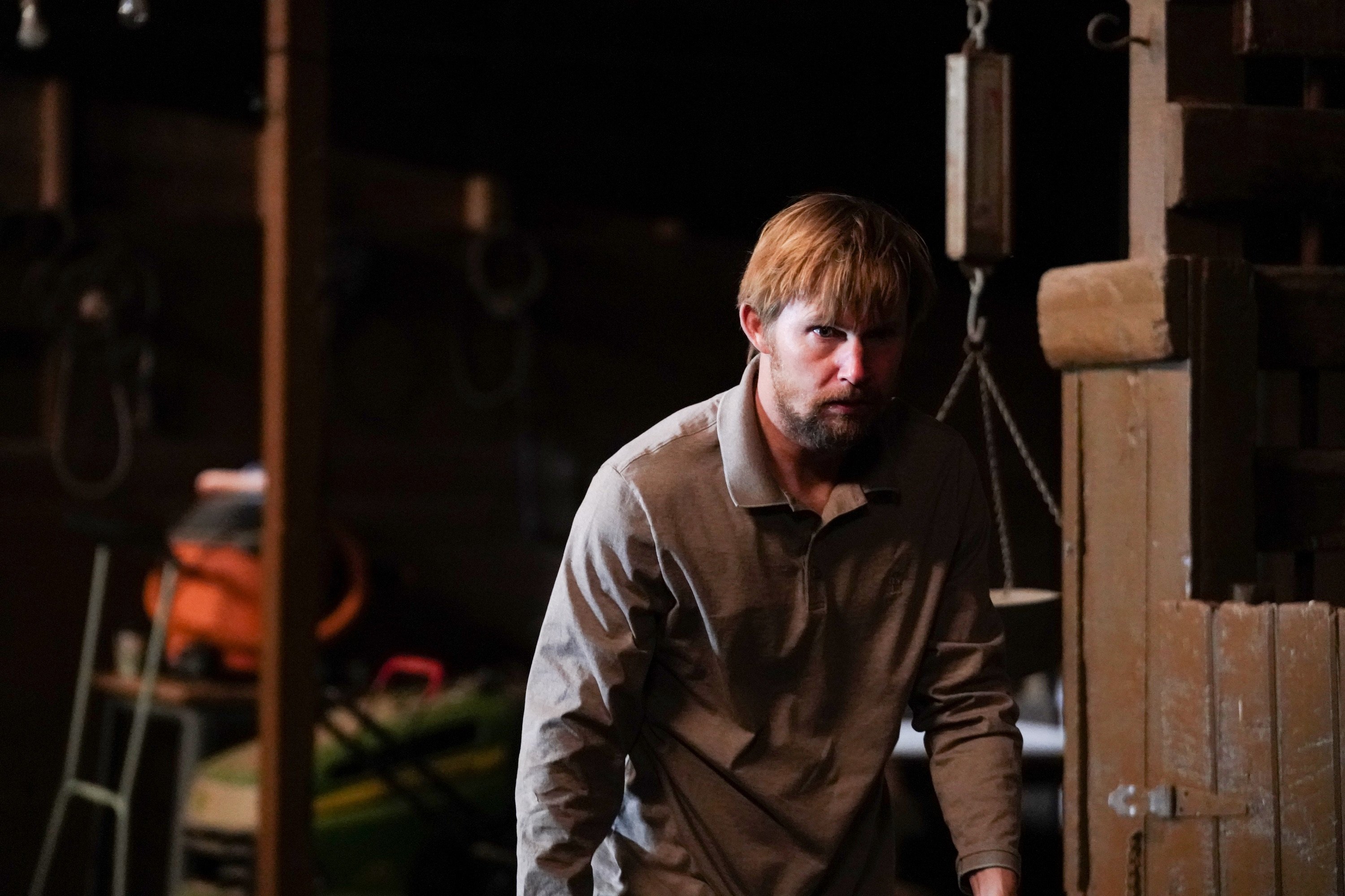 'Big Sky' Brian Geraghty as Ronald Pergman in a dark barn