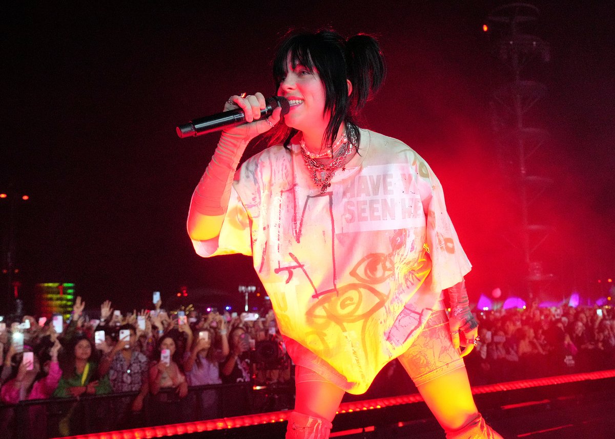 Dressed in biker shorts and a short sleeve top, Billie Eilish performs on stage at the Coachella music festival in Indio, CA.