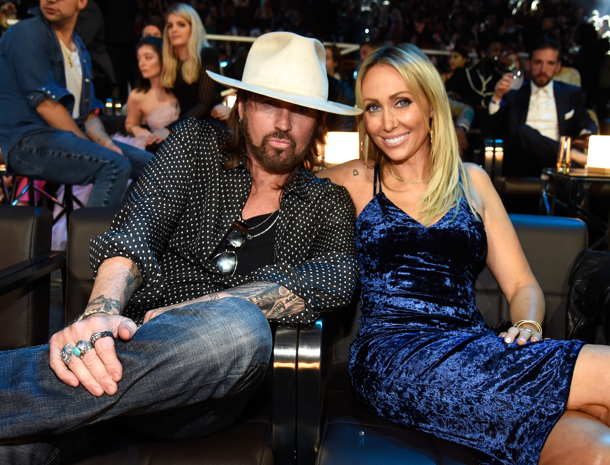 Billy Ray Cyrus and Tish Cyrus sitting together at an awards show