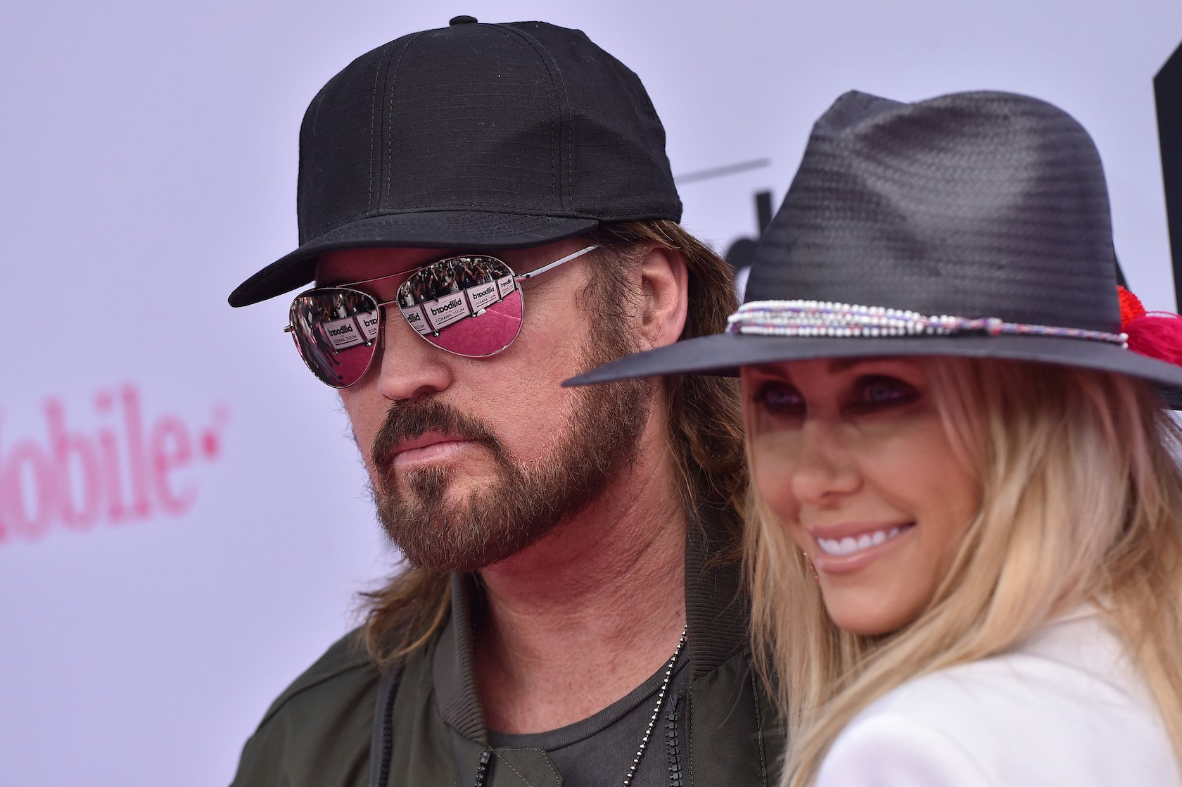 A close-up of Billy Ray Cyrus and Tish Cyrus smiling