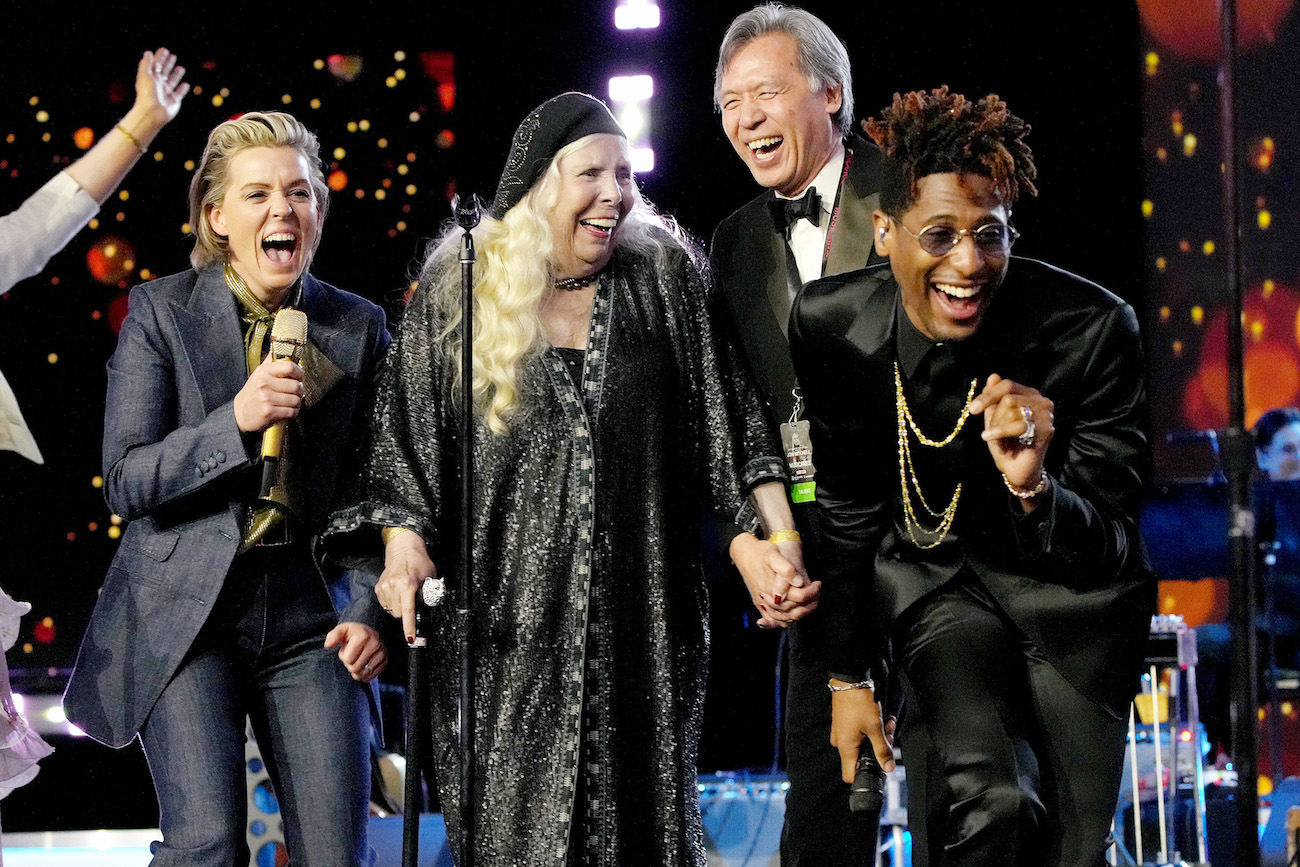 Brandi Carlile, Joni Mitchell, and Jon Batiste performing during the MusiCares Person of the Year Gala honoring Mitchell in 2022.