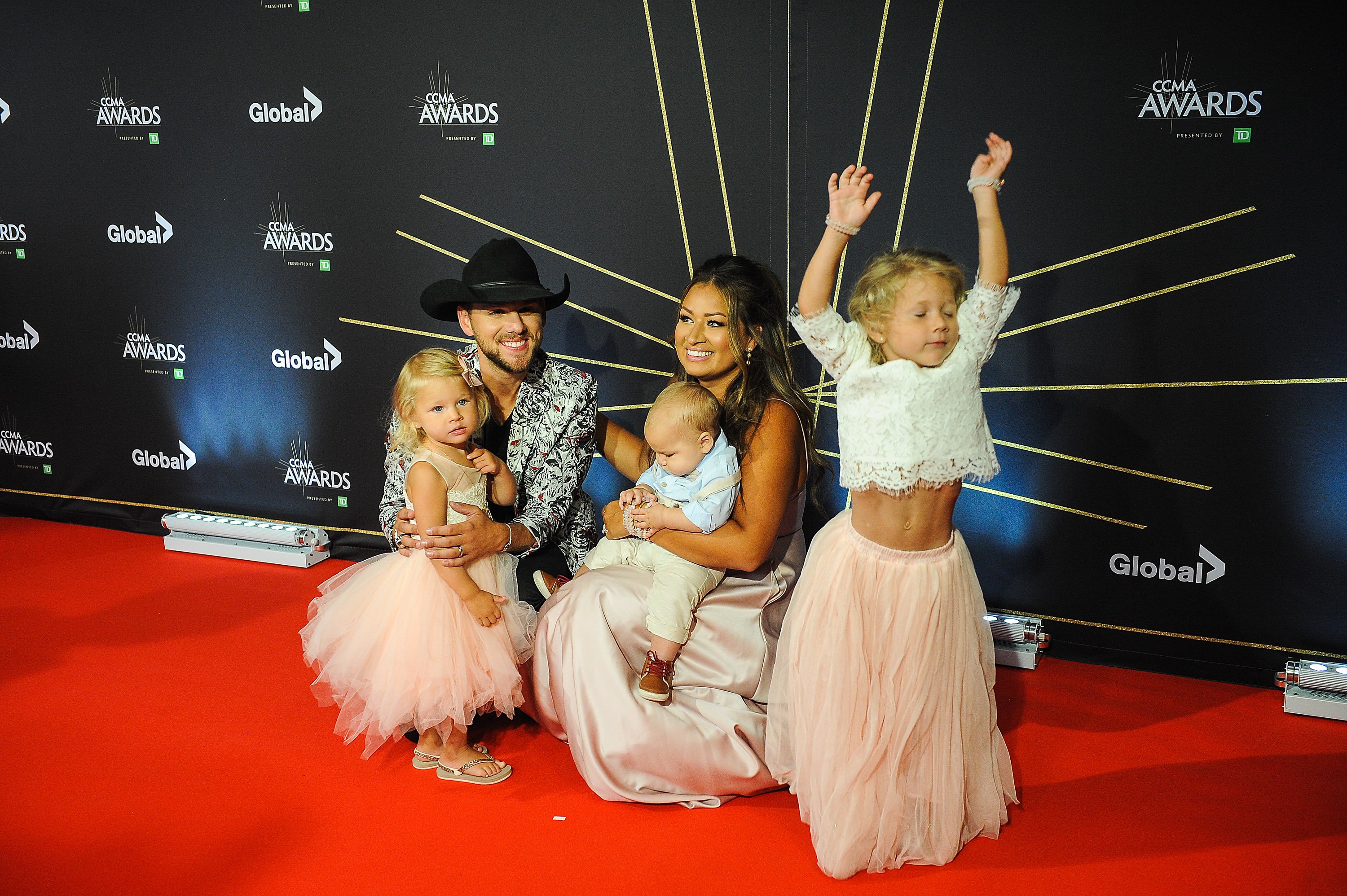 Brett Kissel, singer of 'Ain't The Same' with his wife and kids on the red carpet