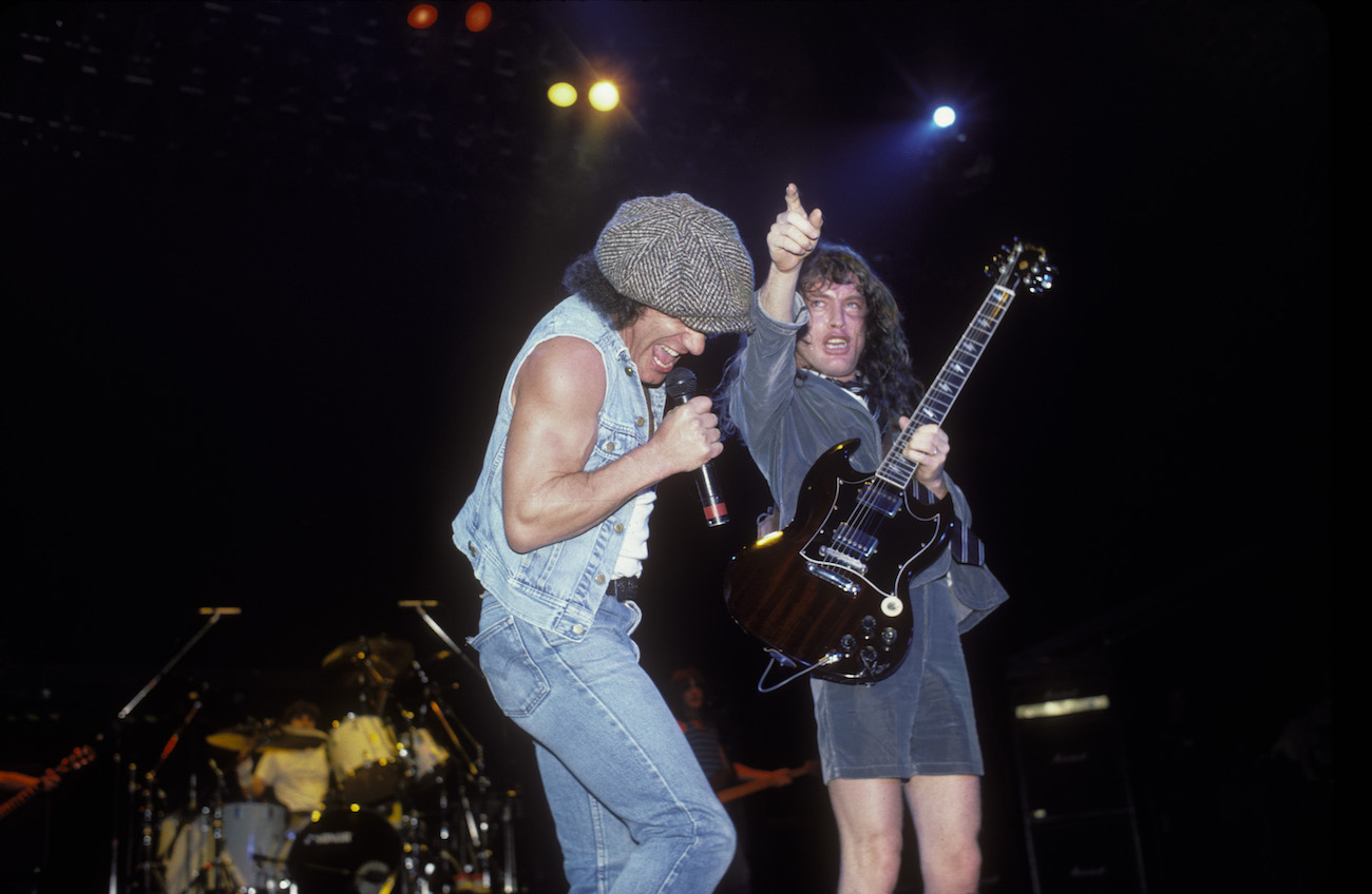Brian Johnson and Angus Young performing with AC/DC in 1985.
