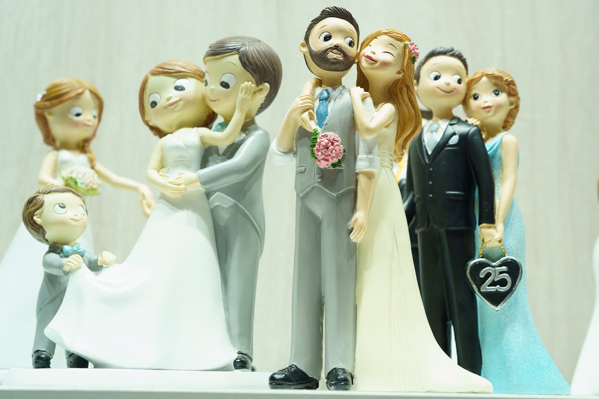 Collection of bride and groom wedding cake toppers