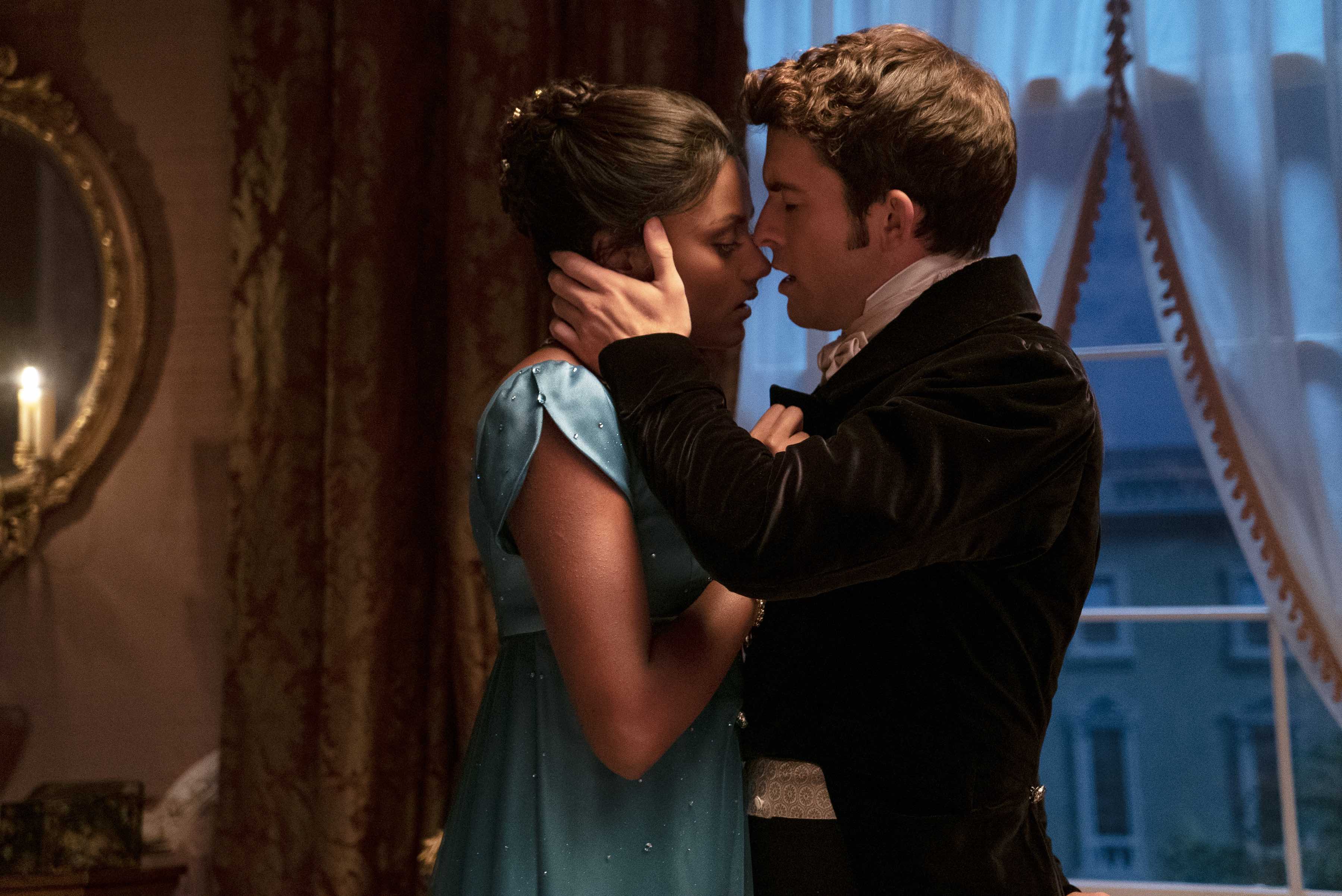 "Bridgerton" characters Kate and Anthony sensually embrace in a still from the show. 