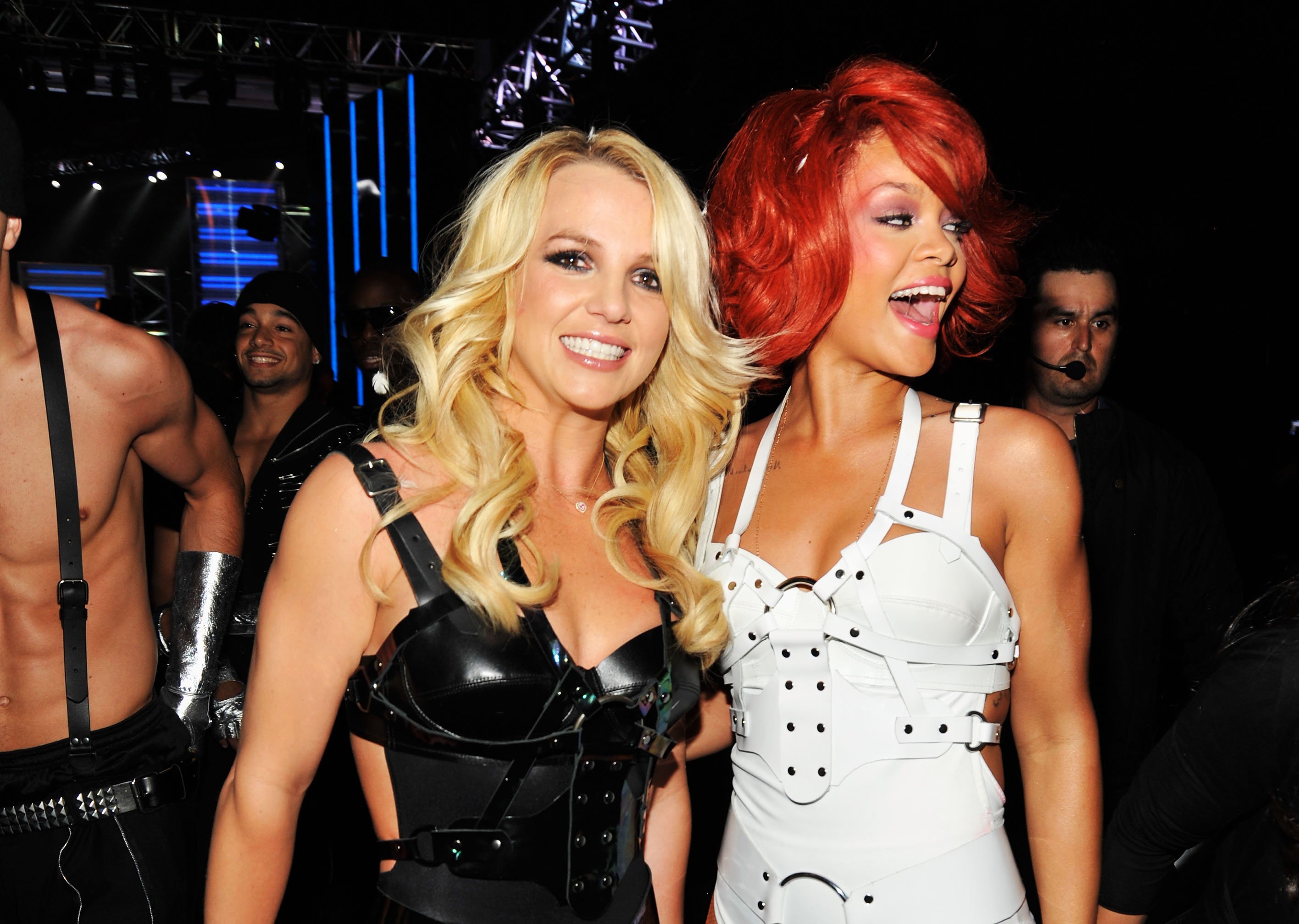 Britney Spears and Rihanna pose together for a picture after a performance.