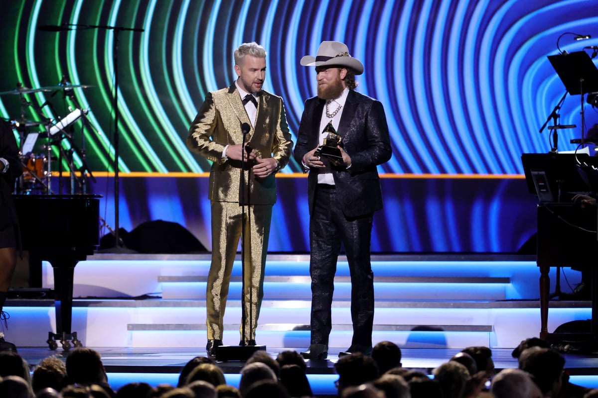 TJ Osborne and John Osborn of Brothers Osborn stands on stage and accept a Grammy Award at the 64th Annual Grammy Awards in LA.