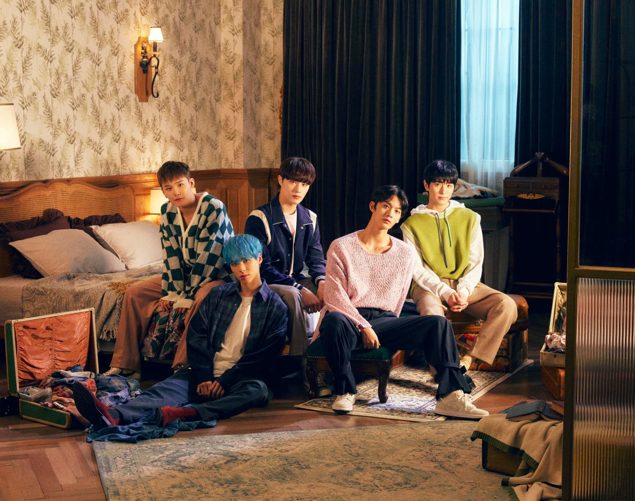 The members of the K-pop group CIX pose for a promotional photo
