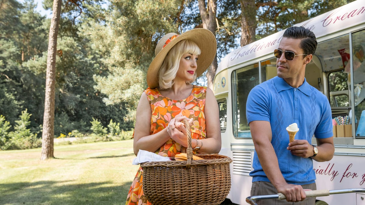 Helen George as Trixie, holding a basket, standing next to Olly Rix as Matthew, holding an ice cream cone in 'Call the Midwife' Season 11