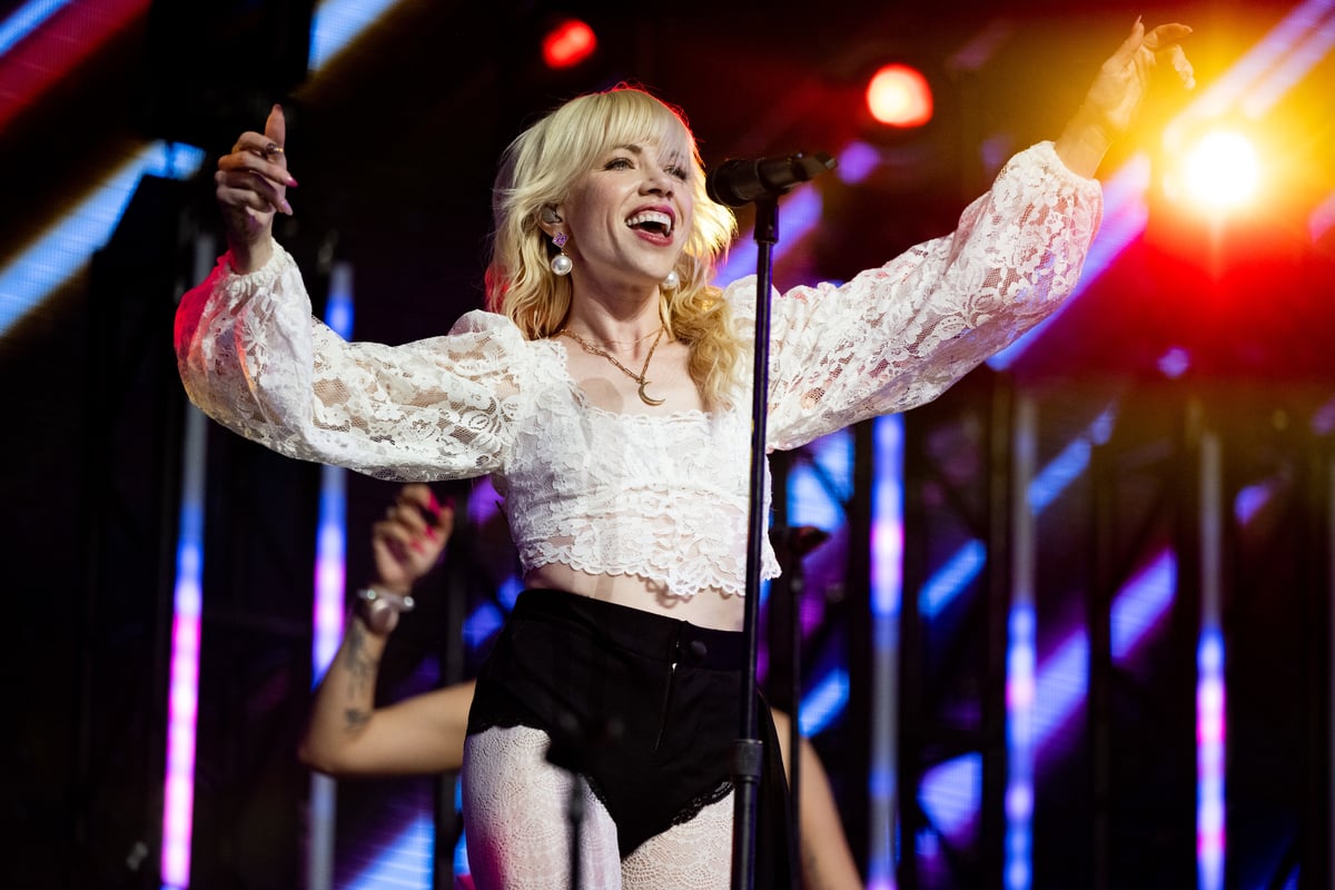Wearing a white lace top and black shorts, Carly Rae Jepsen performs on stage at Coachella in Indio, CA.