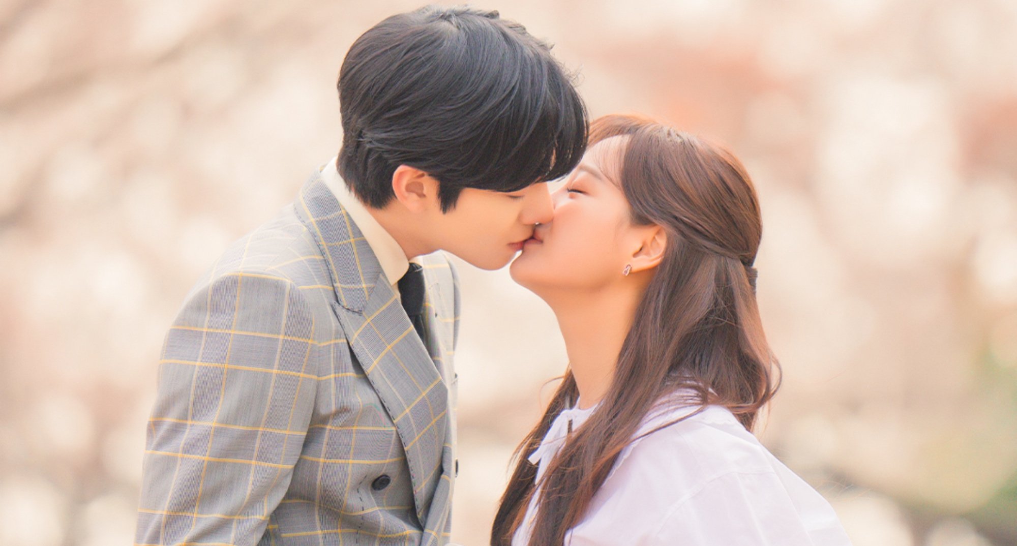 Characters Tae-mu and Ha-ri in 'Business Proposal' finale kissing in relation to webtoon.