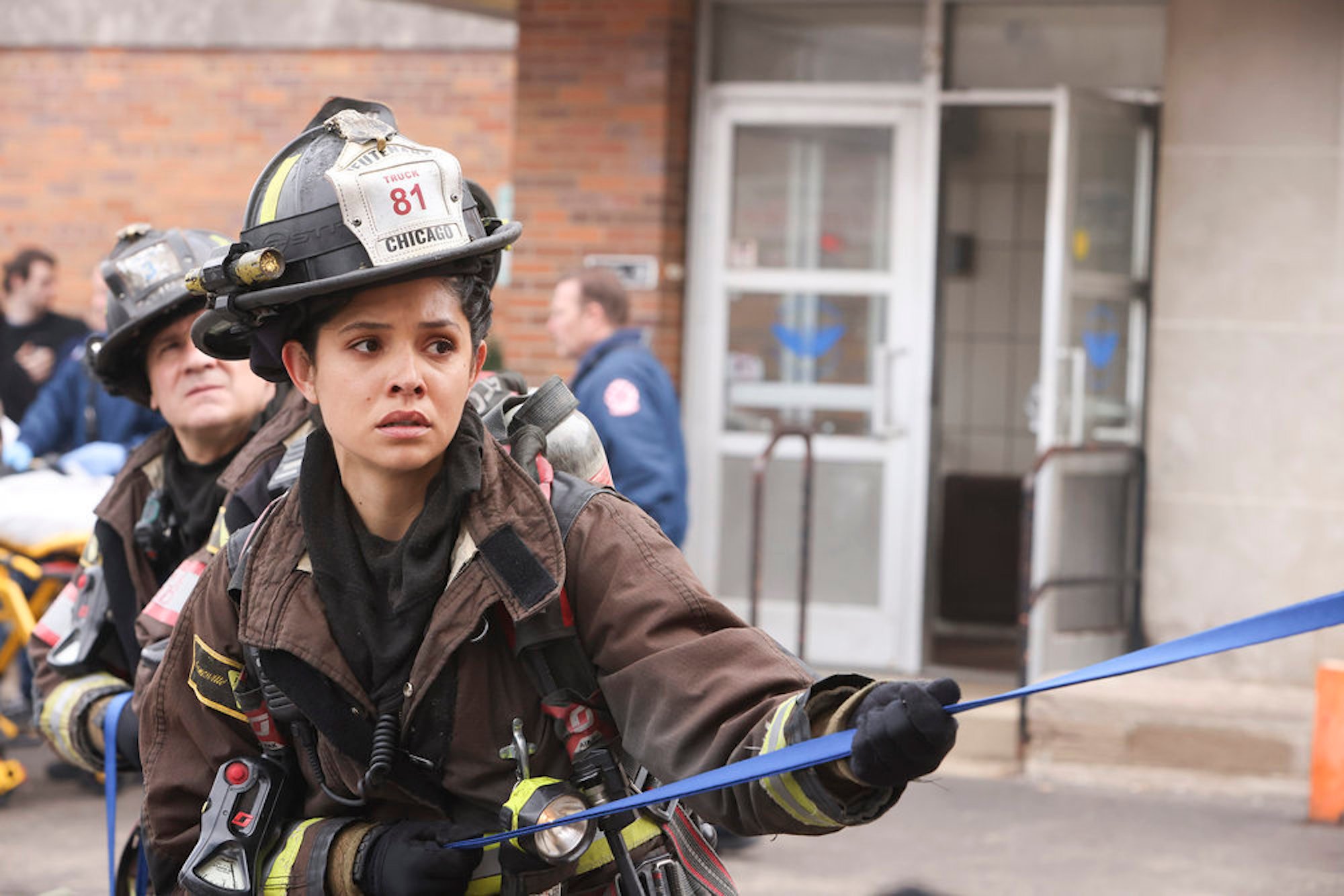 Stella Kidd in uniform outside helping with an emergency in 'Chicago Fire' Season 10