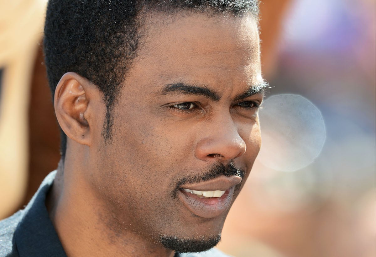 A close-up of Chris Rock posing