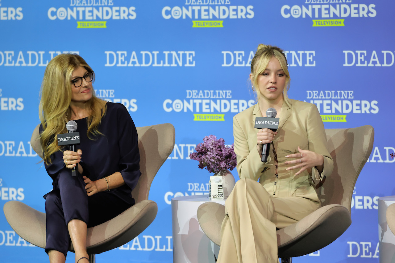 (L-R) Connie Britton and Sydney Sweeney speak while seated on stage