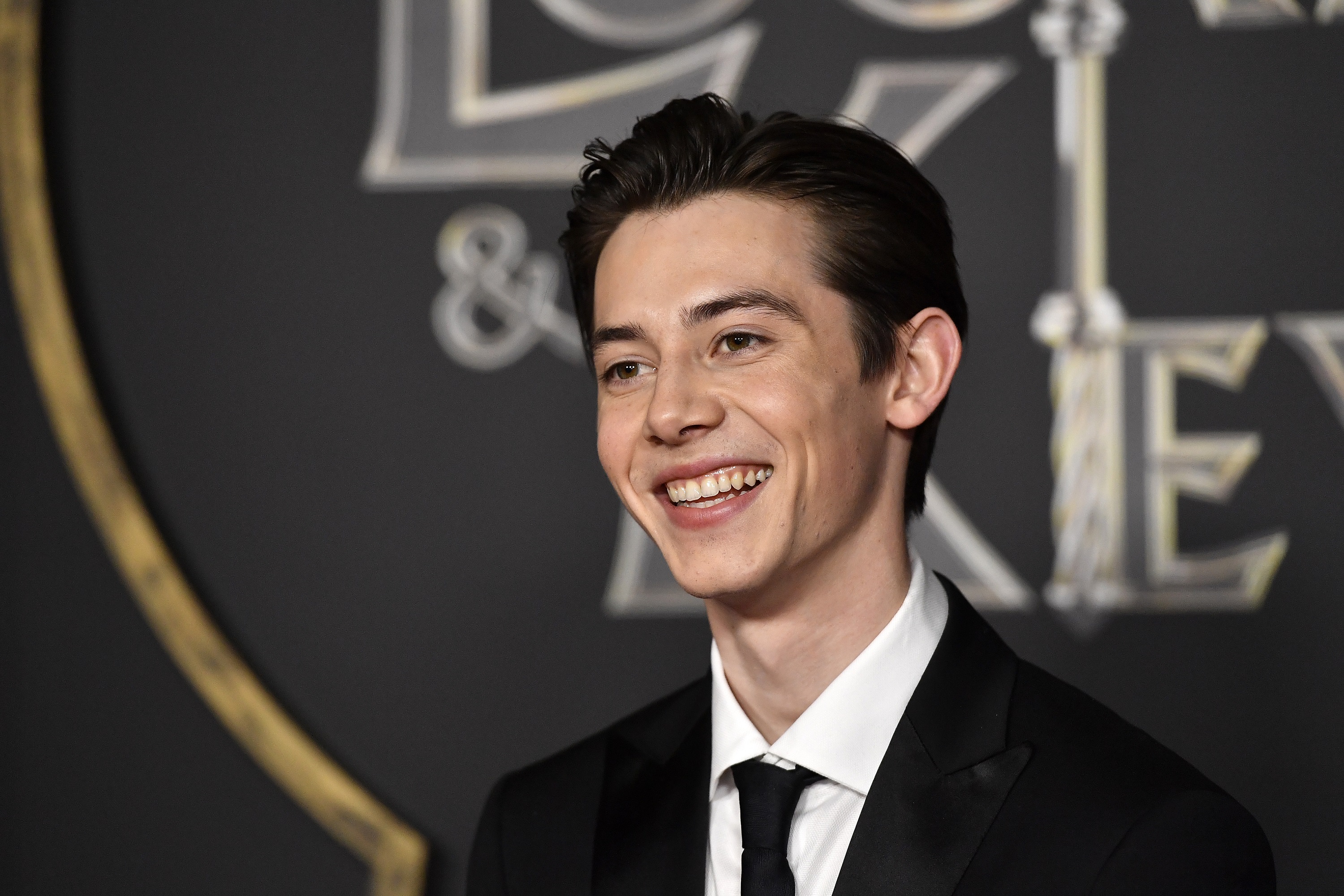 'Cruel Summer' Season 2 cast member Griffin Gluck smiles for photographers at Netflix's 'Locke & Key' Series Premiere