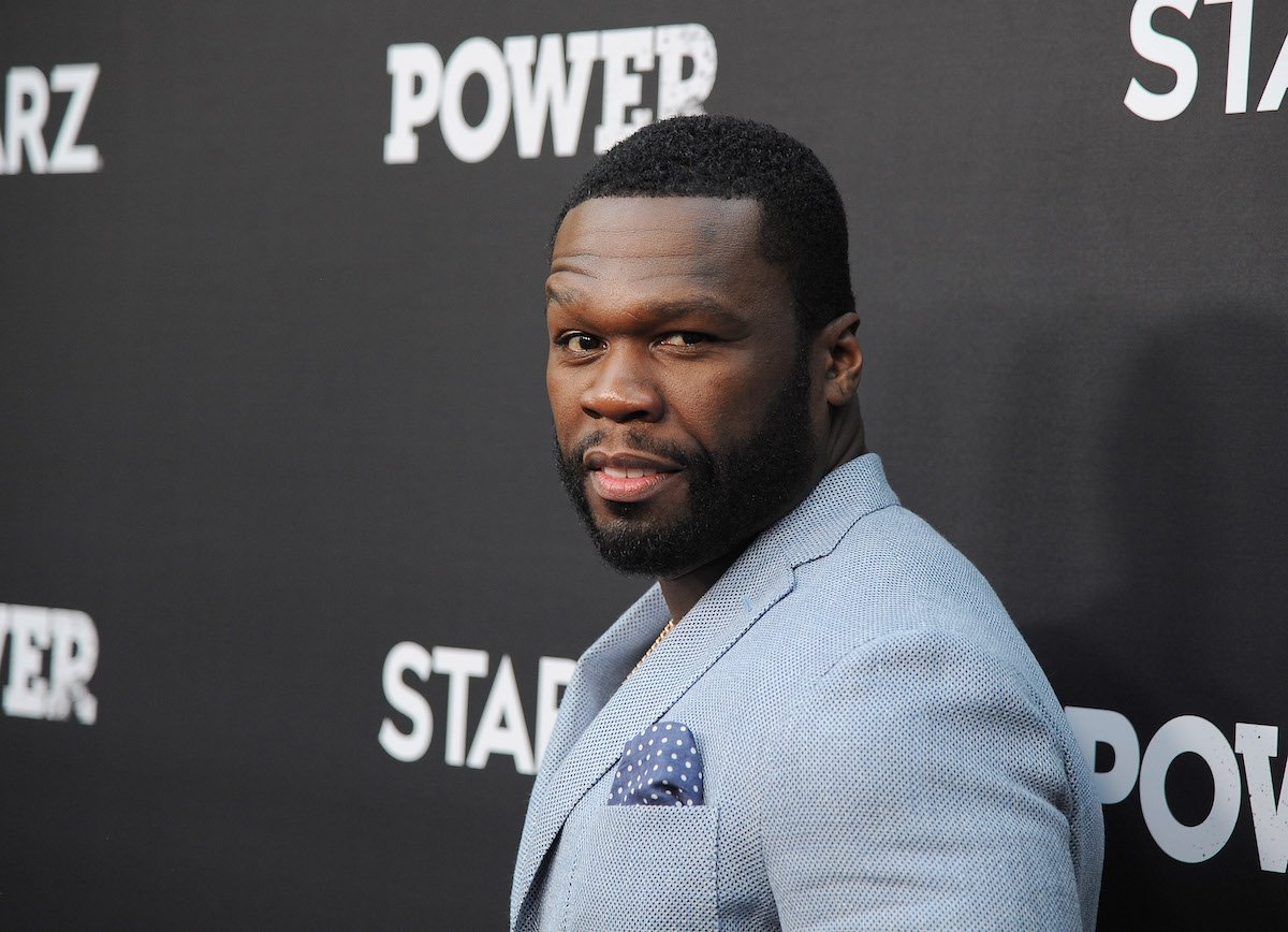 Curtis "50 Cent" Jackson wearing a light blue suit
