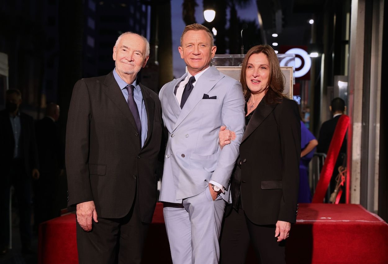 Daniel Craig (middle) with 'James Bond' producers Michael G. Wilson (left) and Barbara Broccoli at Craig's Hollywood Walk of Fame ceremony in 2021.