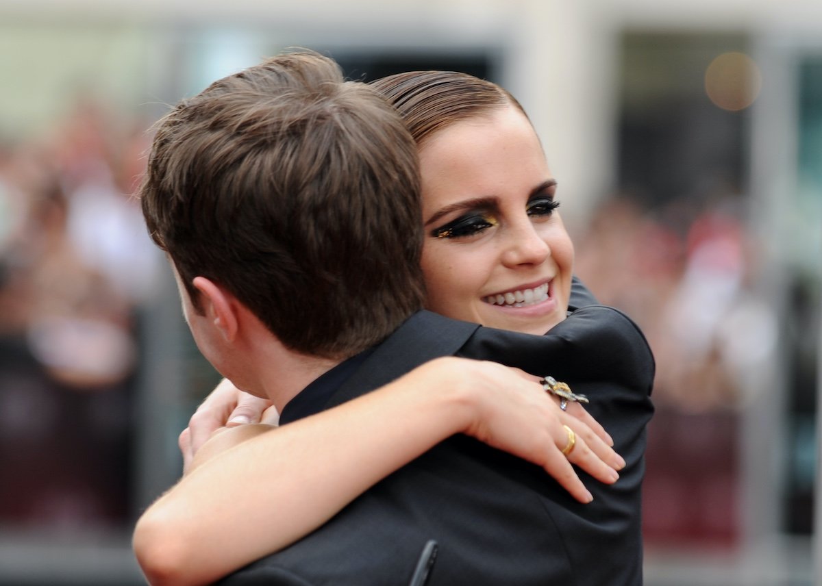 Daniel Radcliffe and Emma Watson, stars of the polarizing Harry and Hermione dance scene in Harry Potter, hug