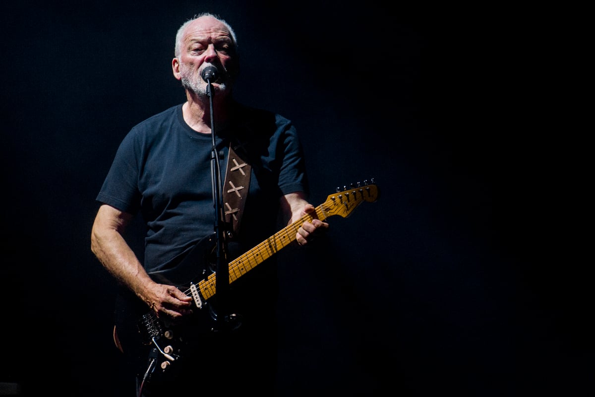 Wearing all black, David Gilmour performs on stage furing a concert in Rome, Italy.