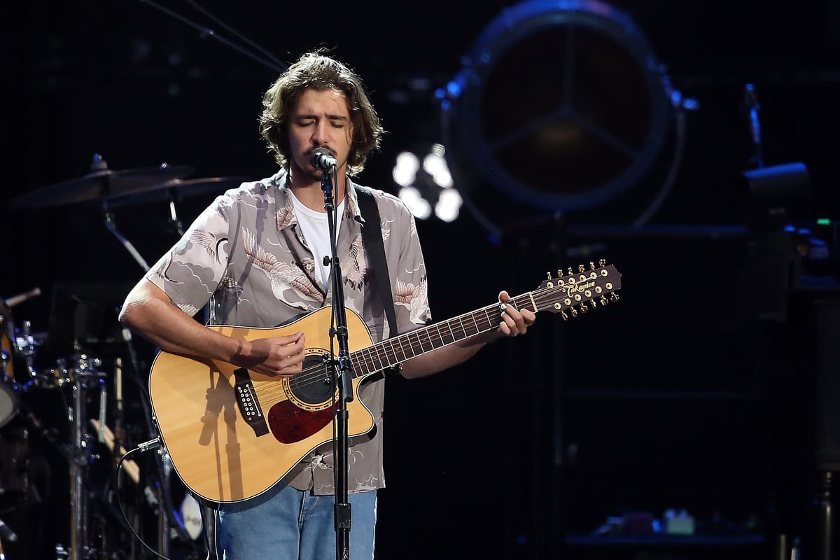 Deacon Frey performs on stage at Wembley Stadium in London England.