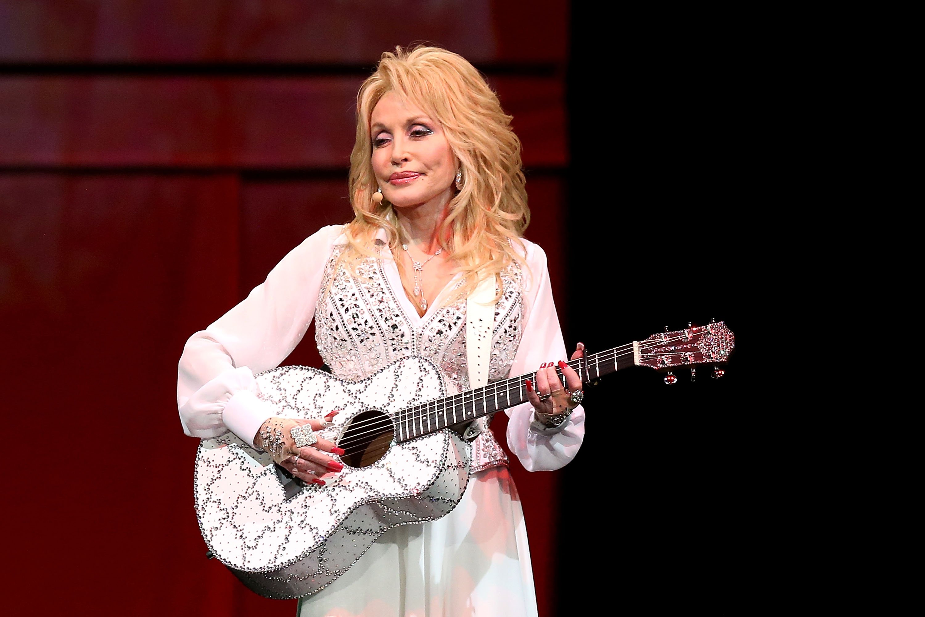 Dolly Parton performing in Australia on stage.