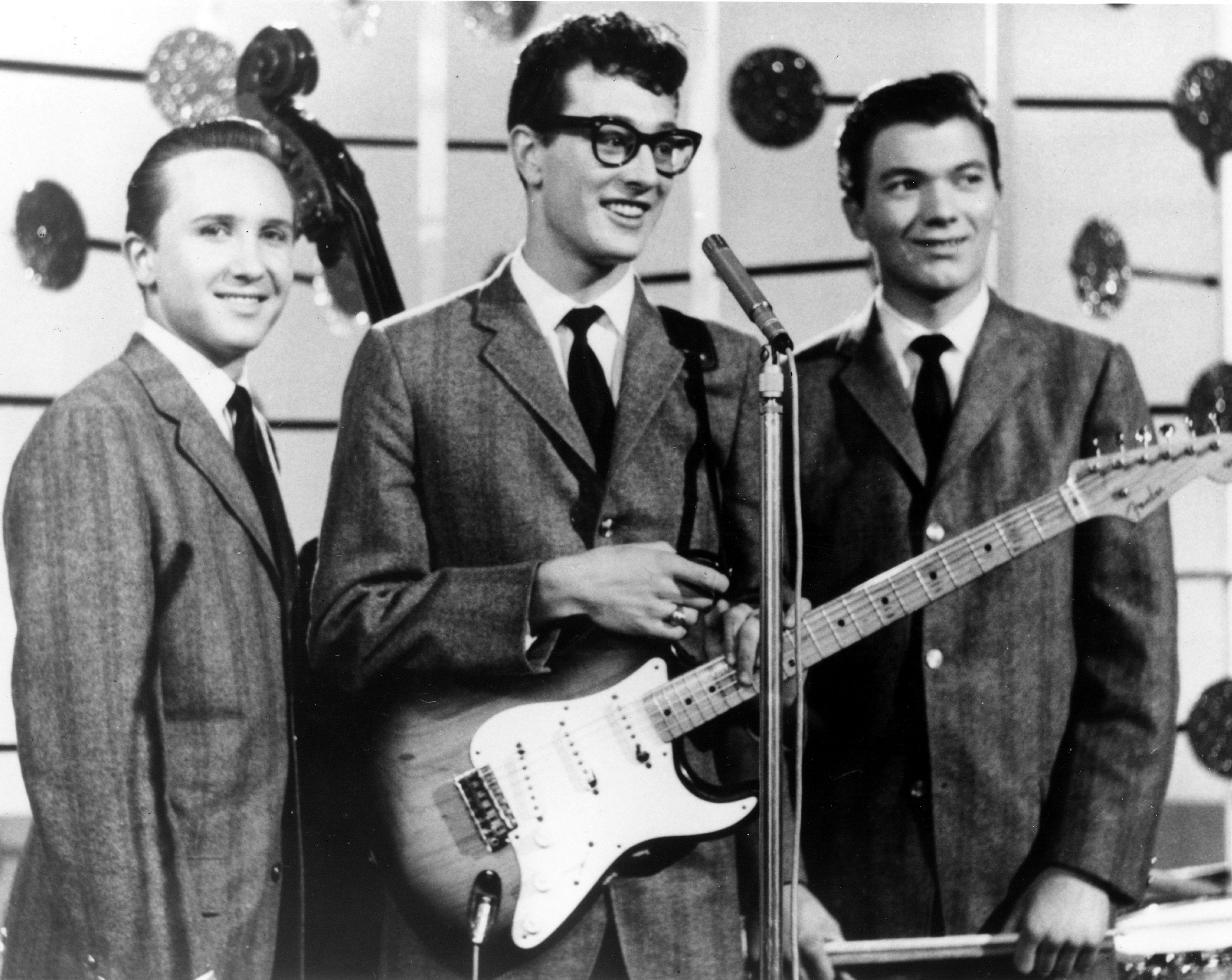 Buddy Holly holding a guitar
