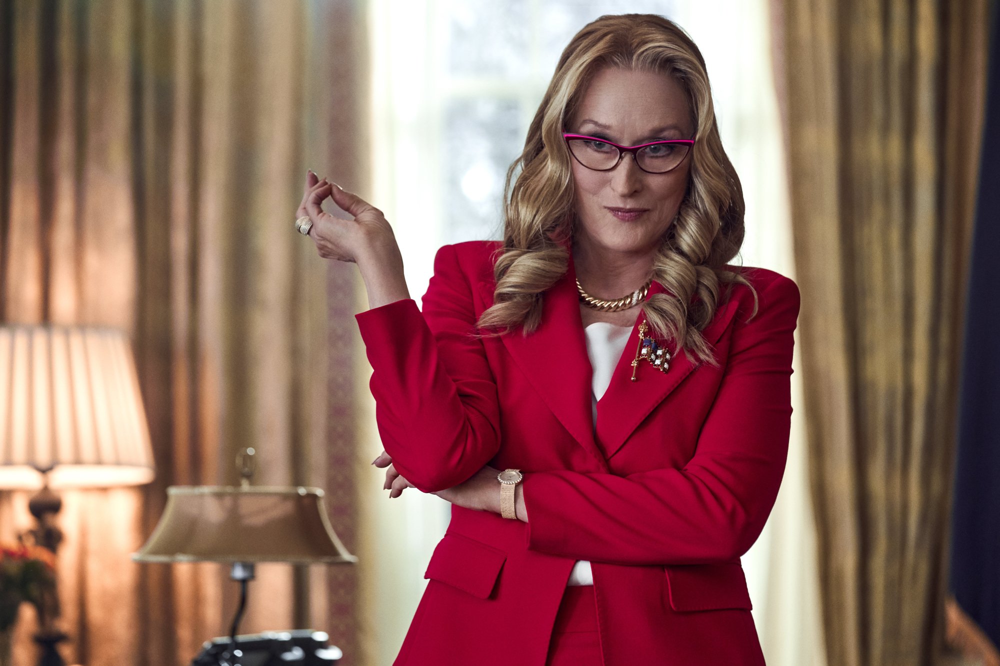 Don't Look Up's Meryl Streep as President Janie Orlean in the Oval Office wearing a red suit