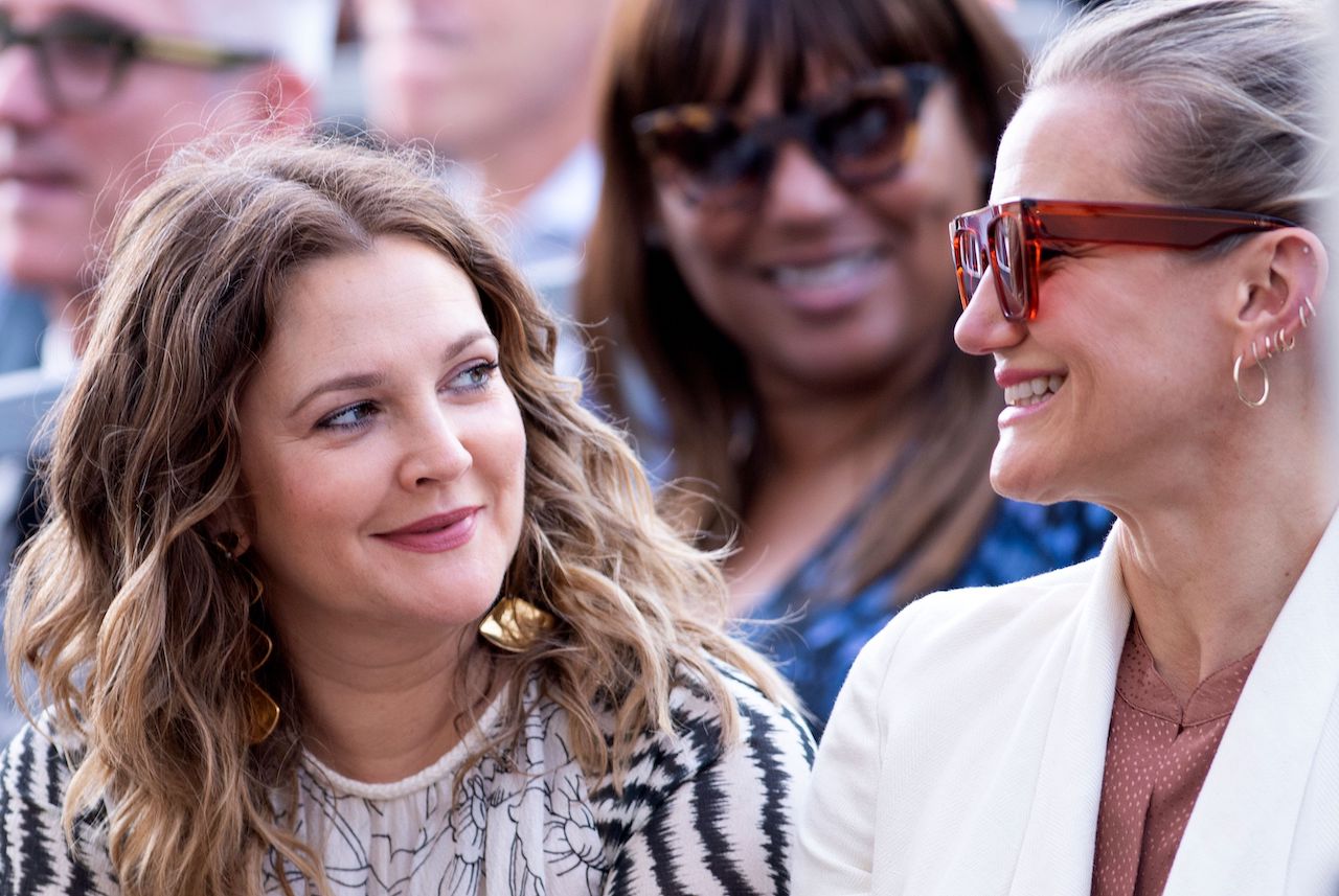 Drew Barrymore and Cameron Diaz glance and smile at each other in 2019