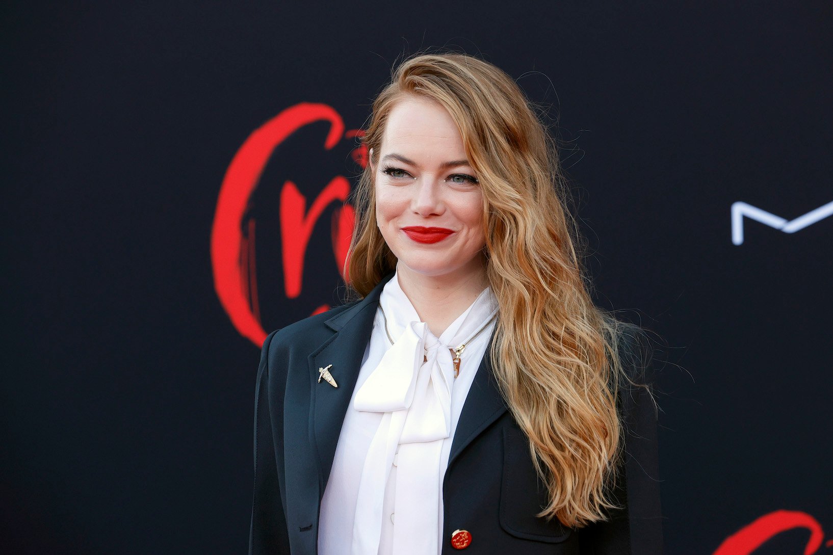 Emma Stone smiling at the 'Cruella' premiere