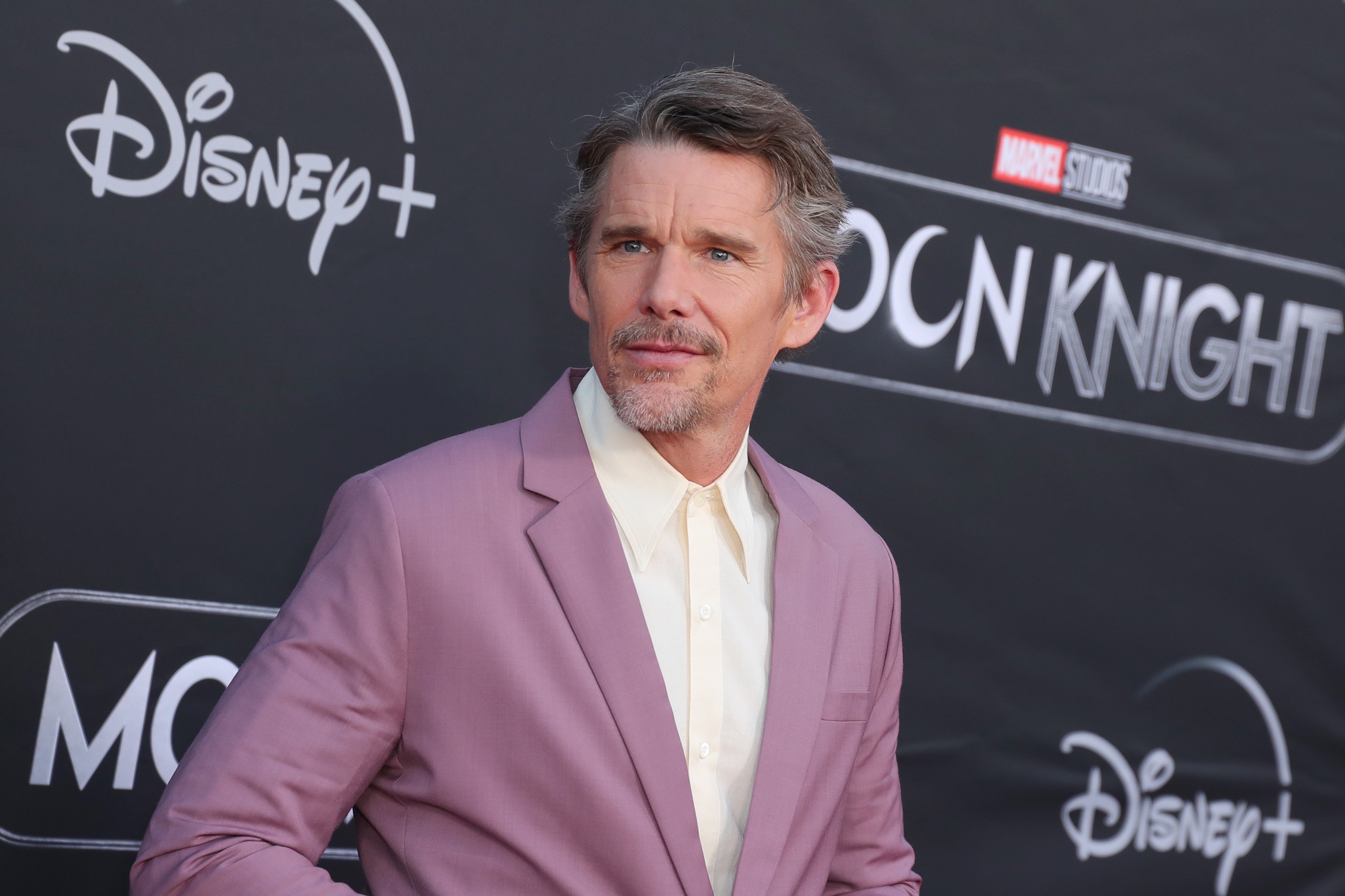 'Moon Knight' star Ethan Hawke wears a light purple suit over a white button-up shirt.