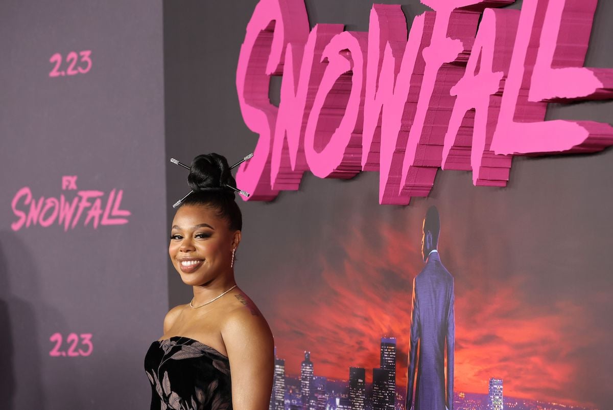 Gail Bean attends FX's "Snowfall" wearing a black dress and top bun