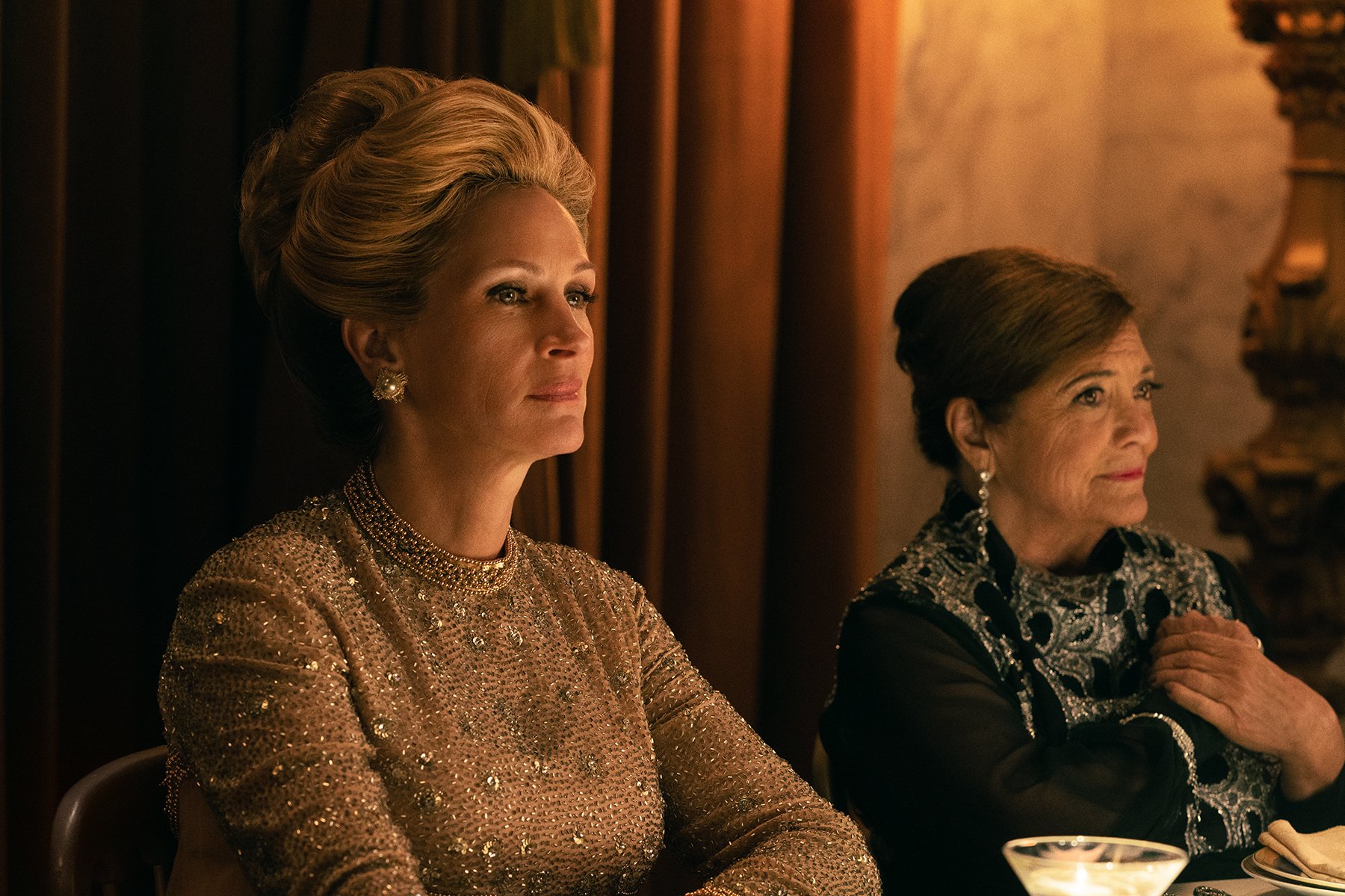 'Gaslit' star Julia Roberts as Martha Mitchell is seen here sitting in a formal gown at a dinner table in a production still from the series.