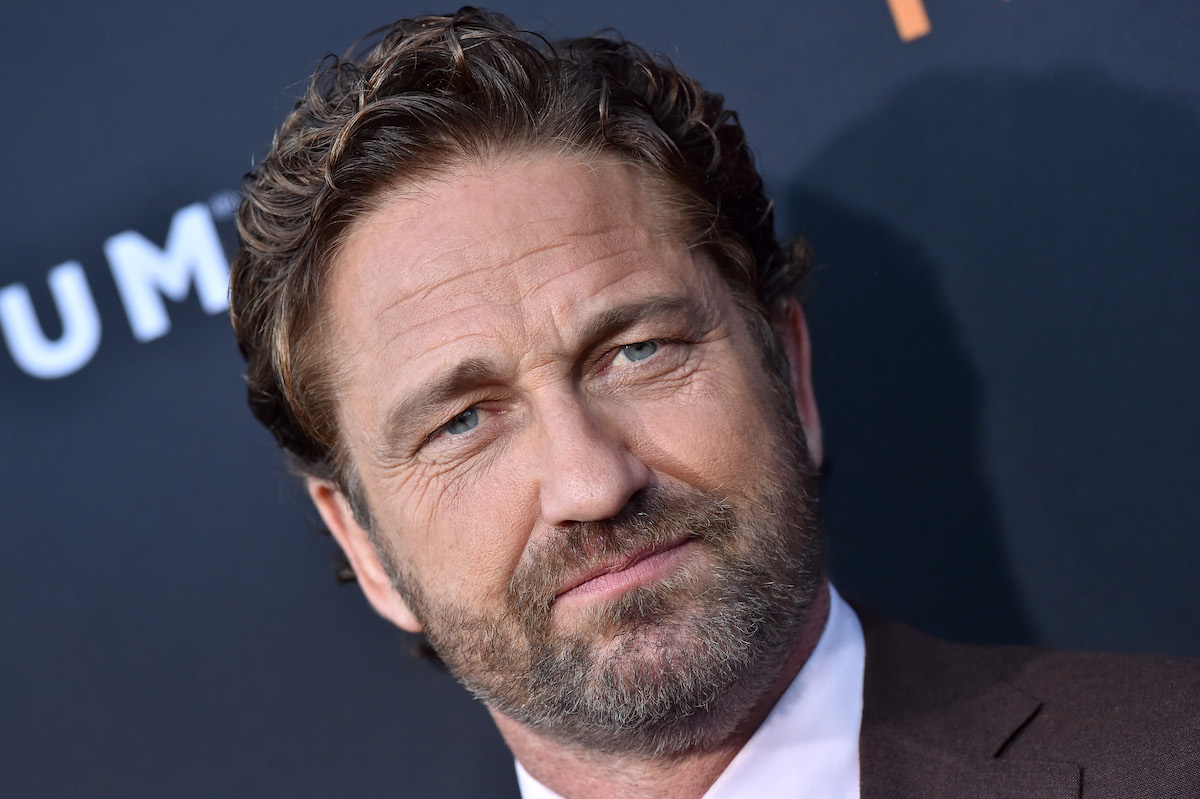 Gerard Butler poses at an event.