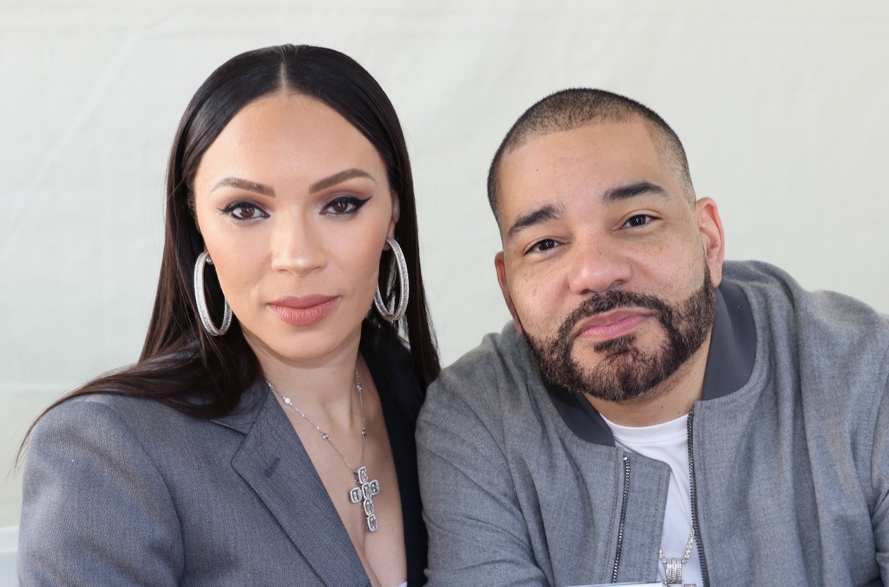 Gia Casey and DJ Envy pose for photo - the couple are promoting their new book