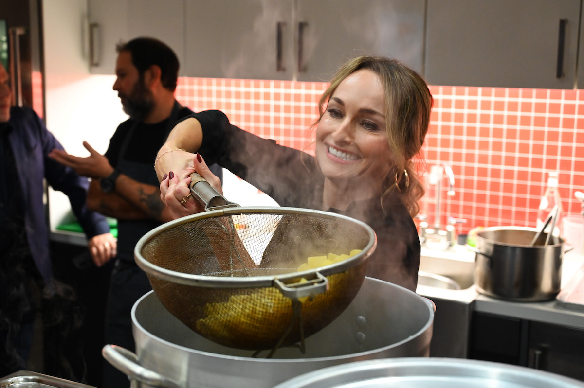 Giada De Laurentiis drains the water from a pot of cooked pasta